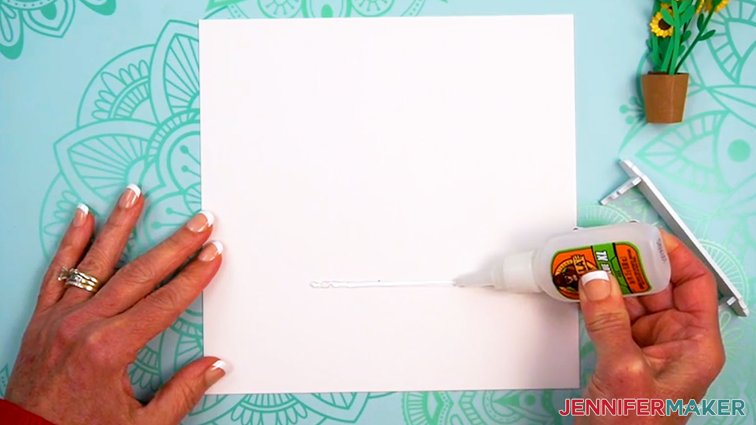 Apply a thin layer of super glue to the cardstock.