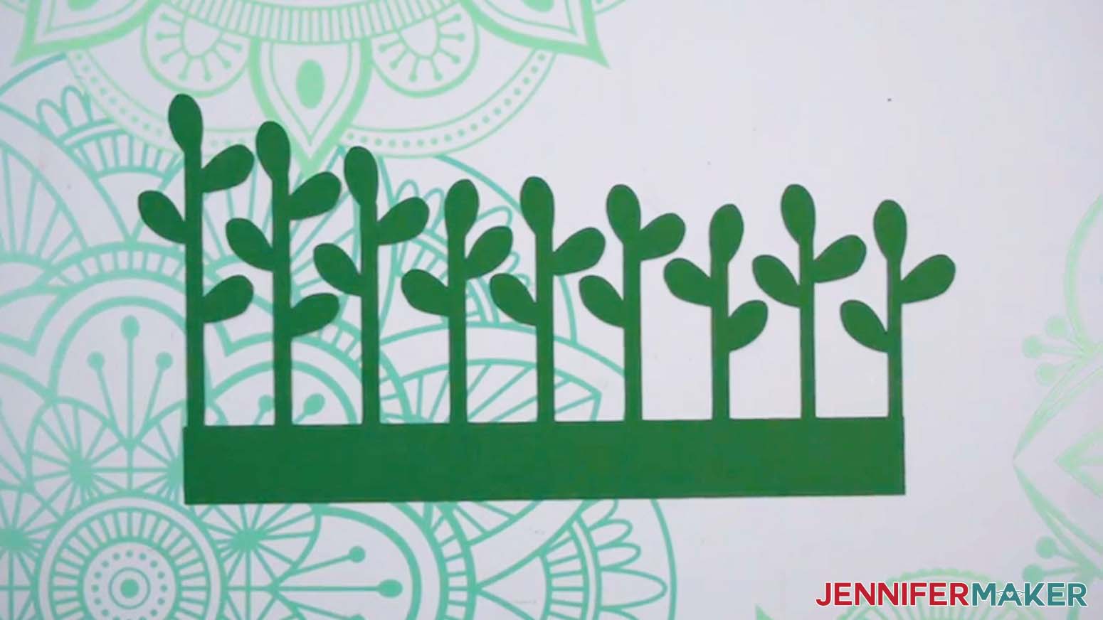 The jade plant cut piece on dark green cardstock.