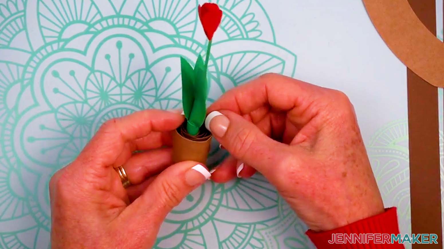 Insert the stem and dirt into the pot.