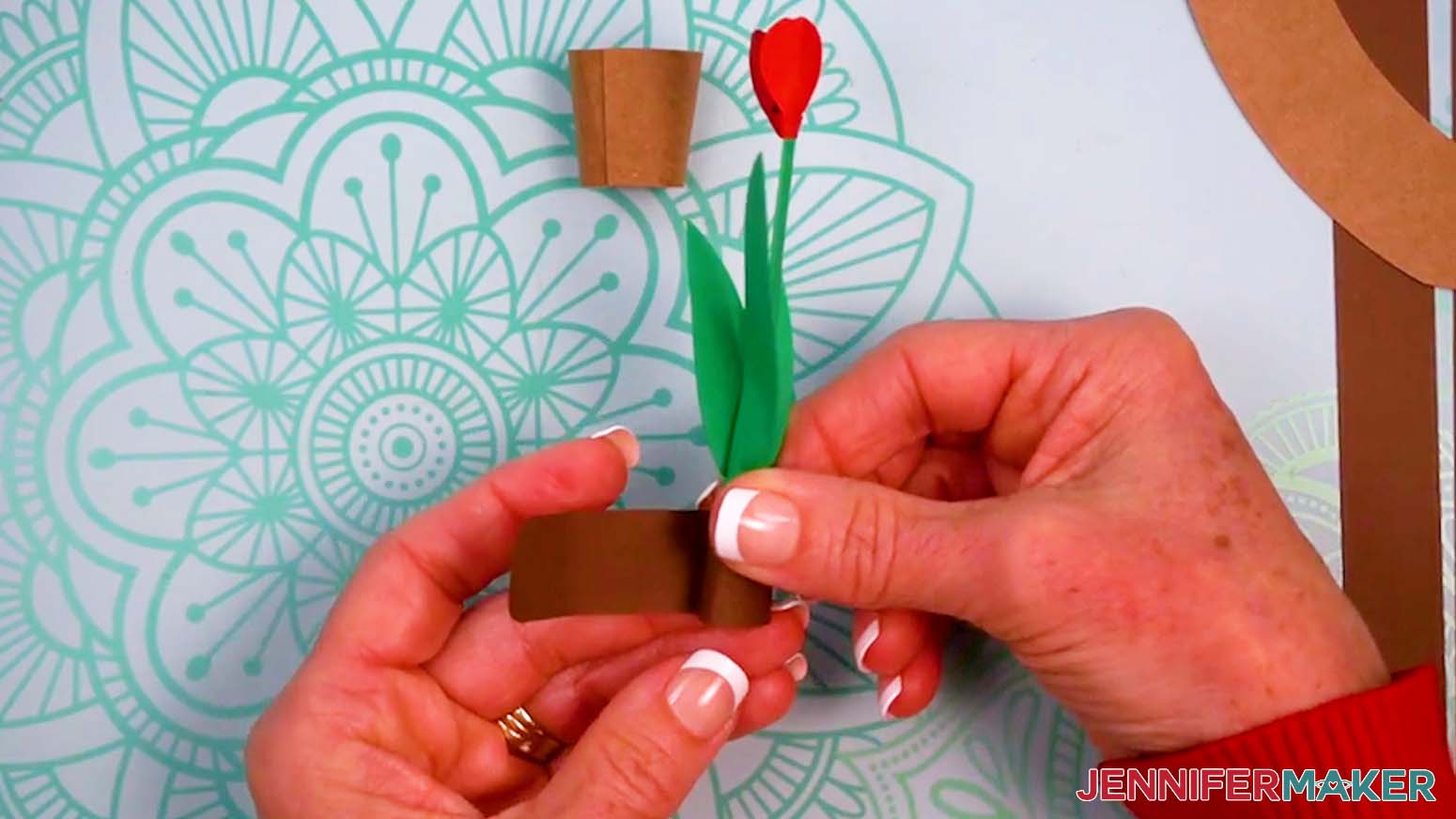 Wrap the dirt strip around the base of the green stem.