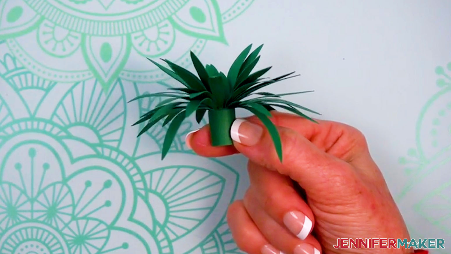 Glue the end to keep the rolled leaves together and the spider plant is complete.