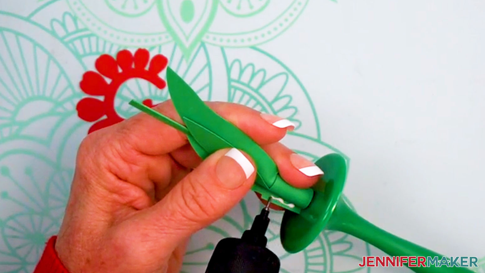 Apply craft glue at the end of the rolled leaves to adhere it together.