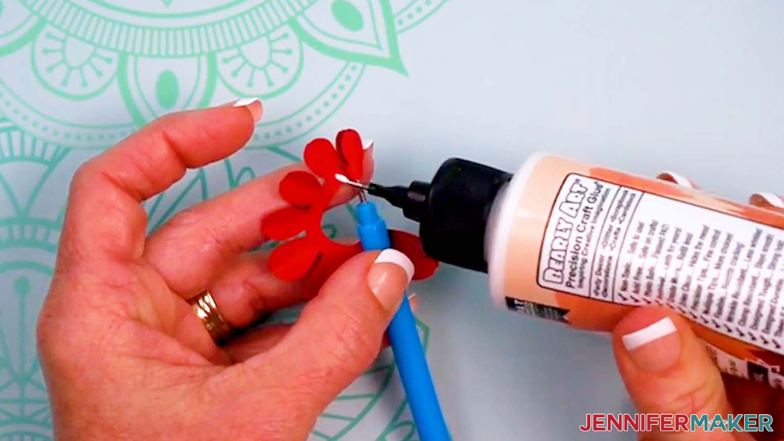Apply small dots of craft glue while rolling the mini tulip to keep it together.