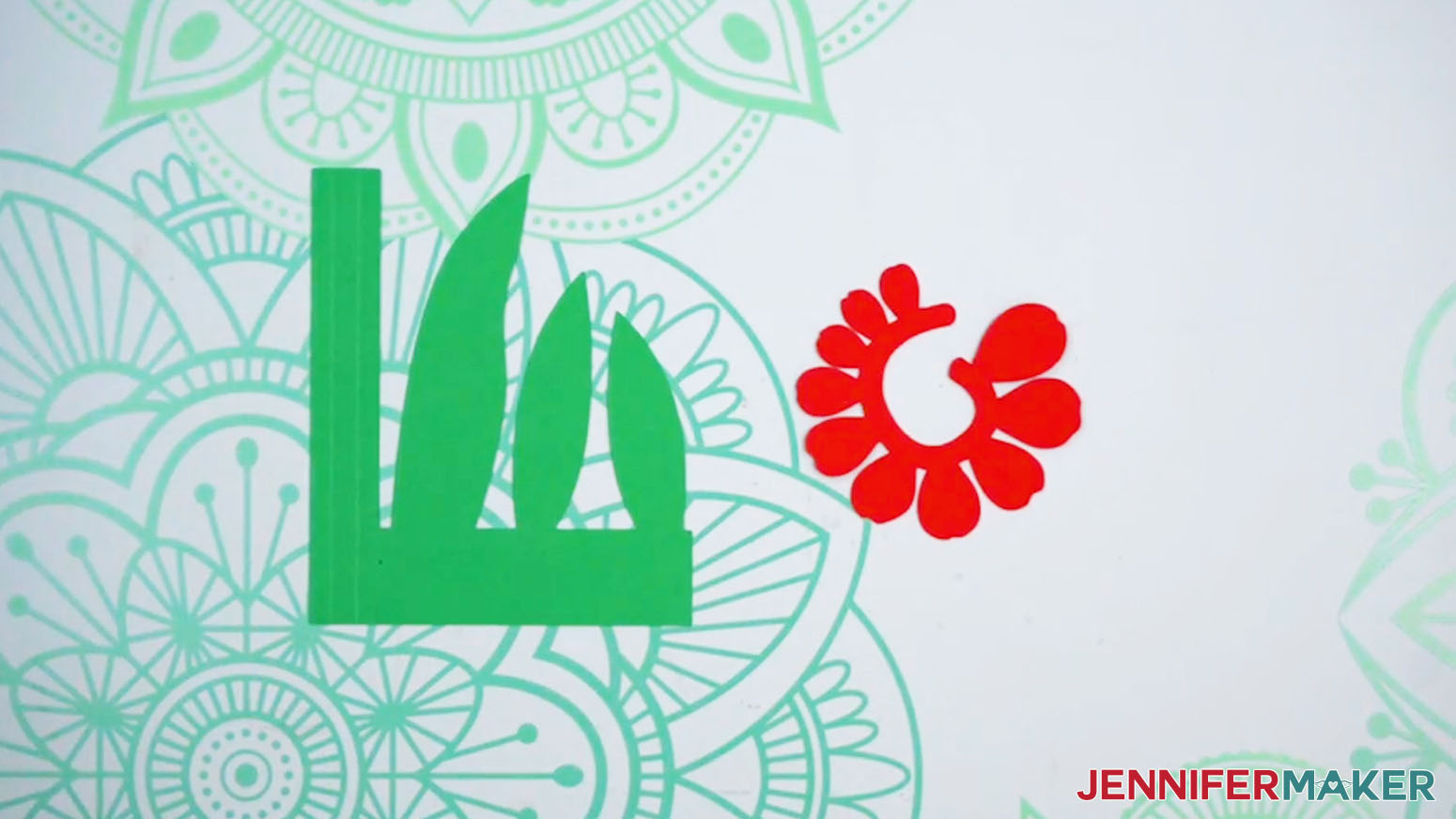 The tulip pieces with a scored green stem and red flower petals.