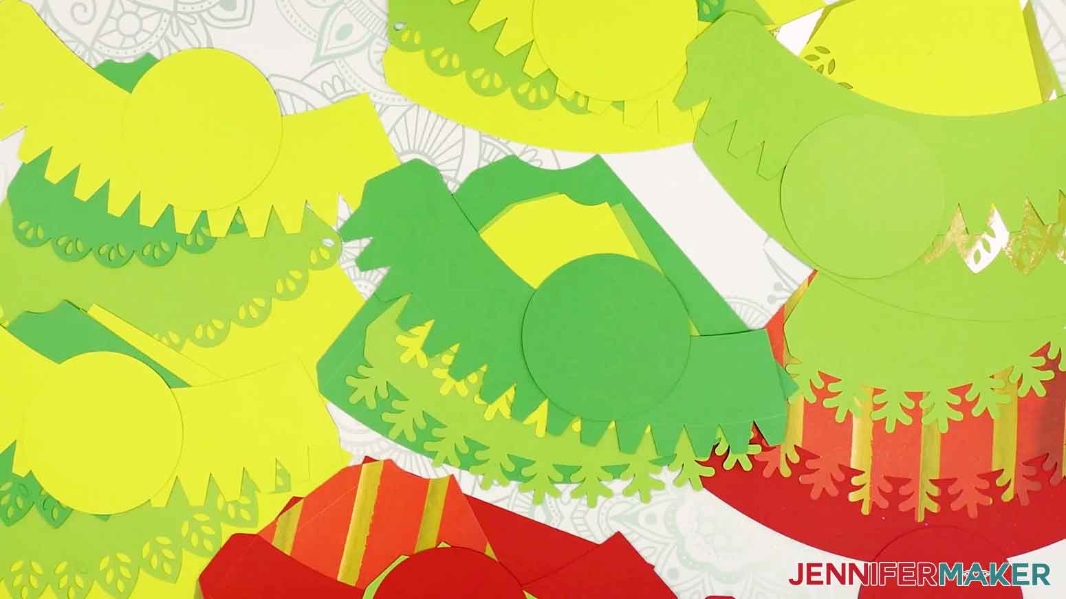 All the minimalist tree advent calendar pieces face up in piles.