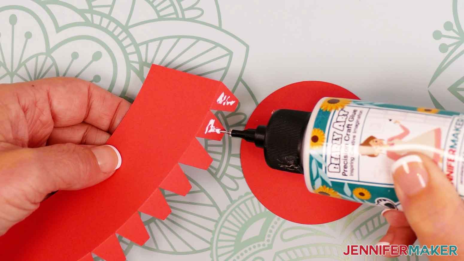 Add a little craft glue to the outside of the side panel&rsquo;s first two tabs.