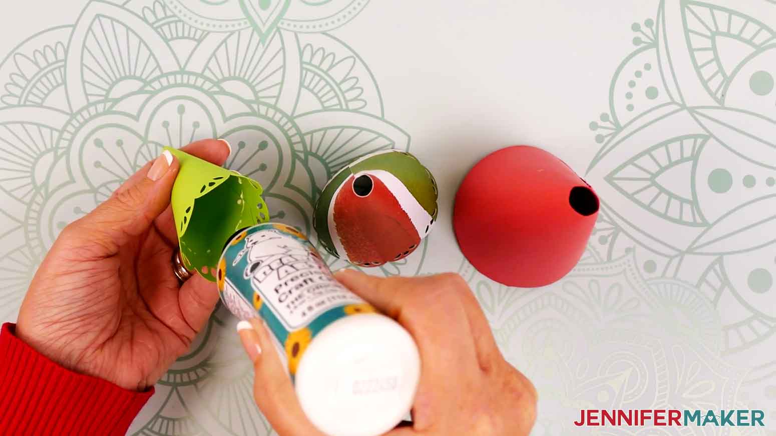 Remove the top tree piece and add a line of craft glue around the inside, about half an inch from the cutout design.