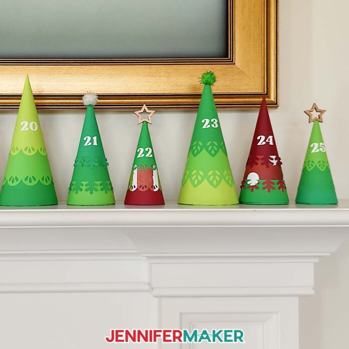 Minimalist Tree Advent Calendar project on a fireplace mantel, made up of colorful cone-shaped tree boxes made from cardstock