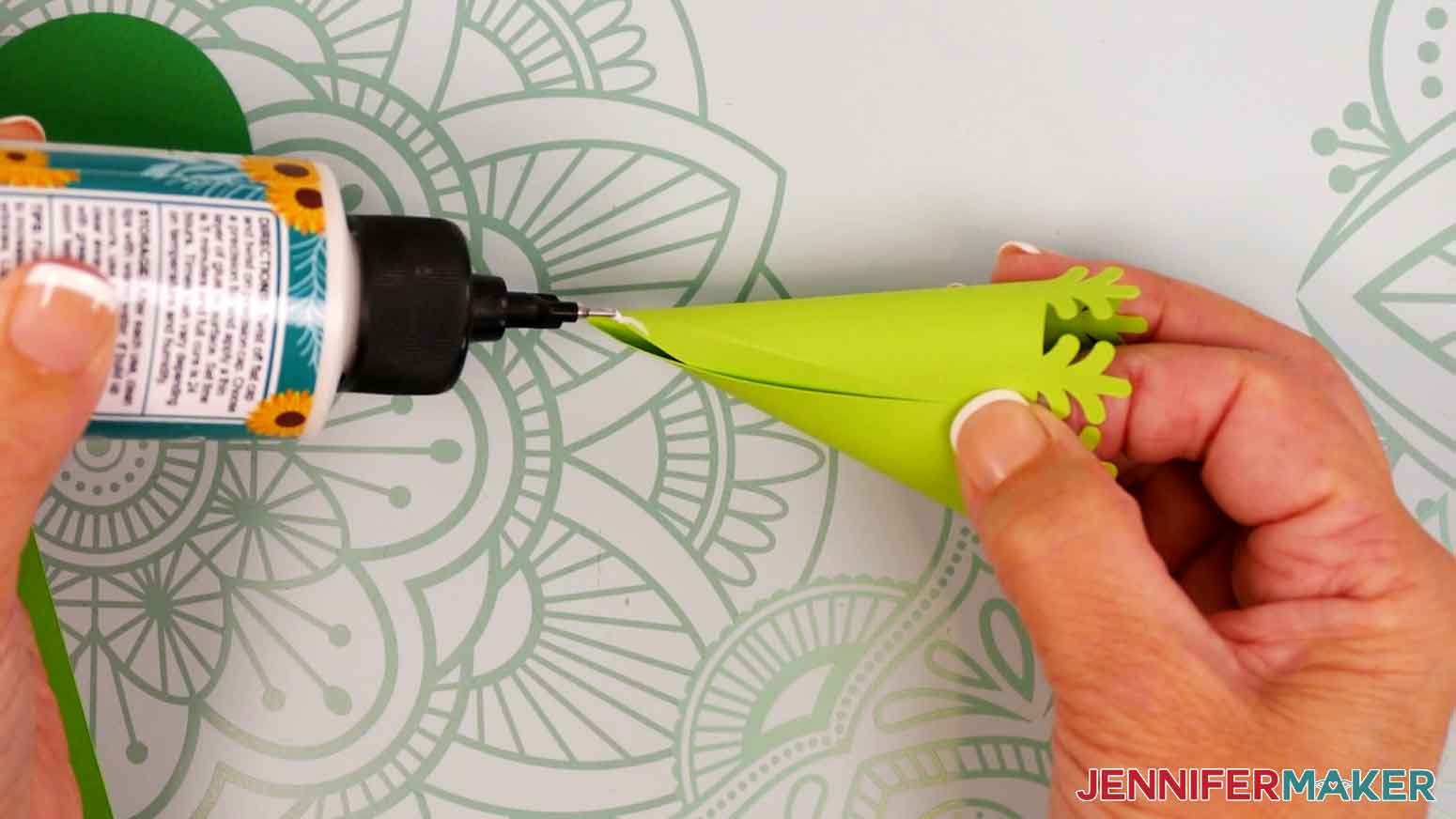 Add a small amount of craft glue where the cardstock overlaps on the top half of the tree piece.
