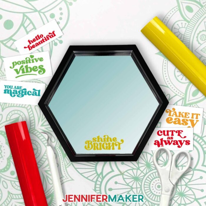 A black octagonal mirror with "shine bright" added in Cricut Value Vinyl surrounded by Cricut vinyl quotes on carrier sheets.