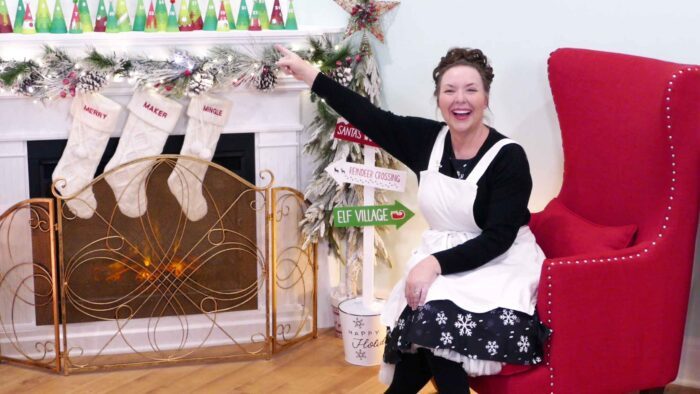 Jennifer at fireplace with advent calendar
