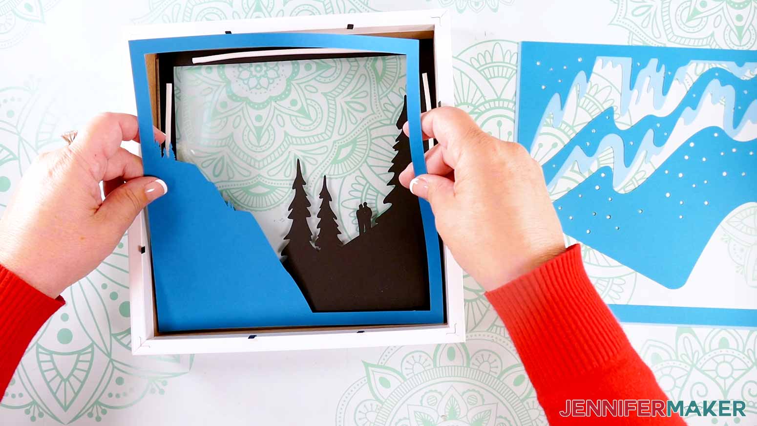 Aligning the bottom half of the layers inside the frame to make a Northern Lights Shadow Box