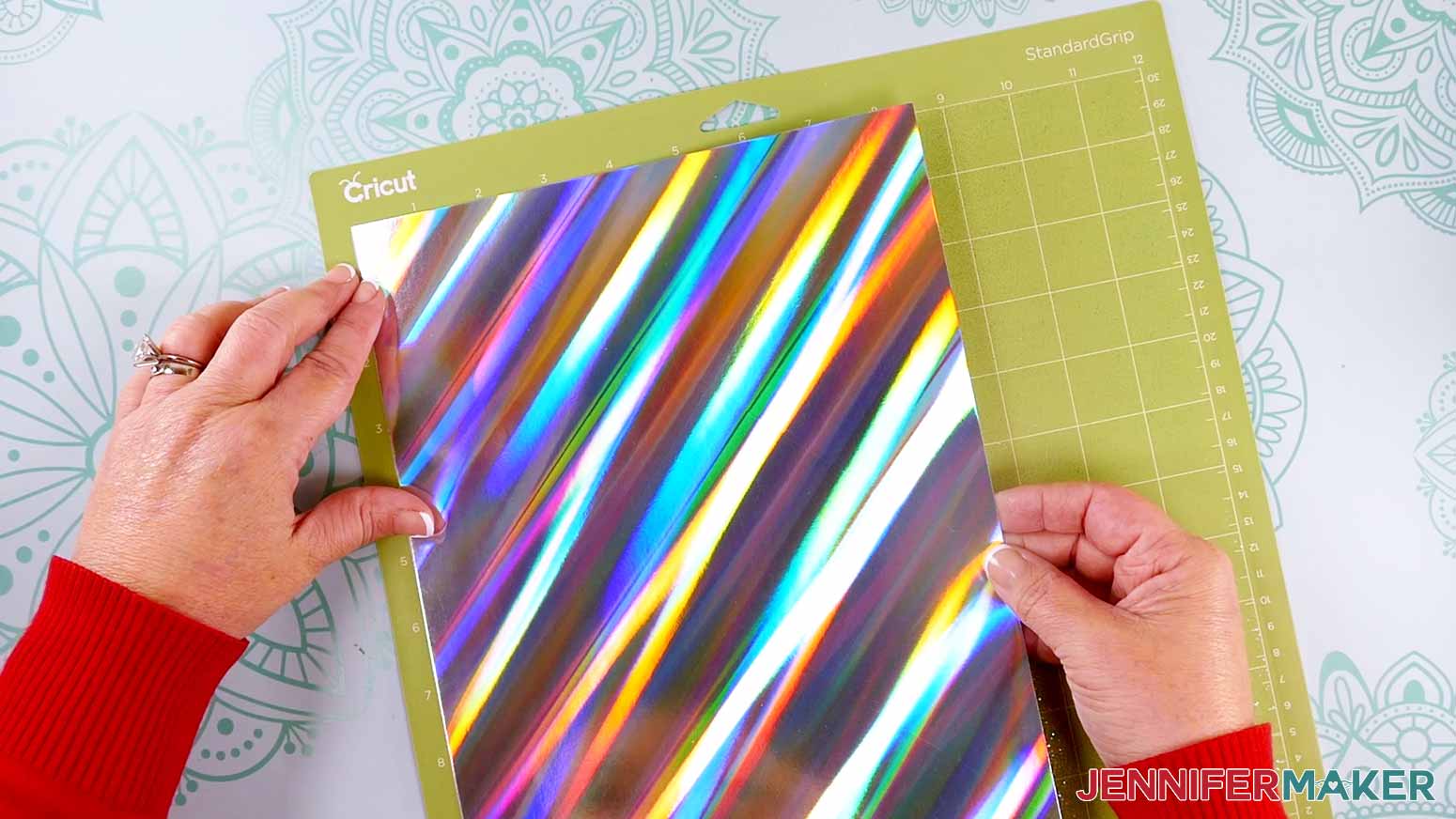 Attaching colorful holographic cardstock to a StandardGrip machine mat to make a Northern Lights Shadow Box