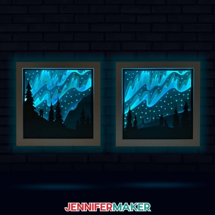 Two different Northern Light Shadow Box projects lit up in the dark