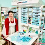 Jennifer Maker with her craft supplies organized into a DreamBox