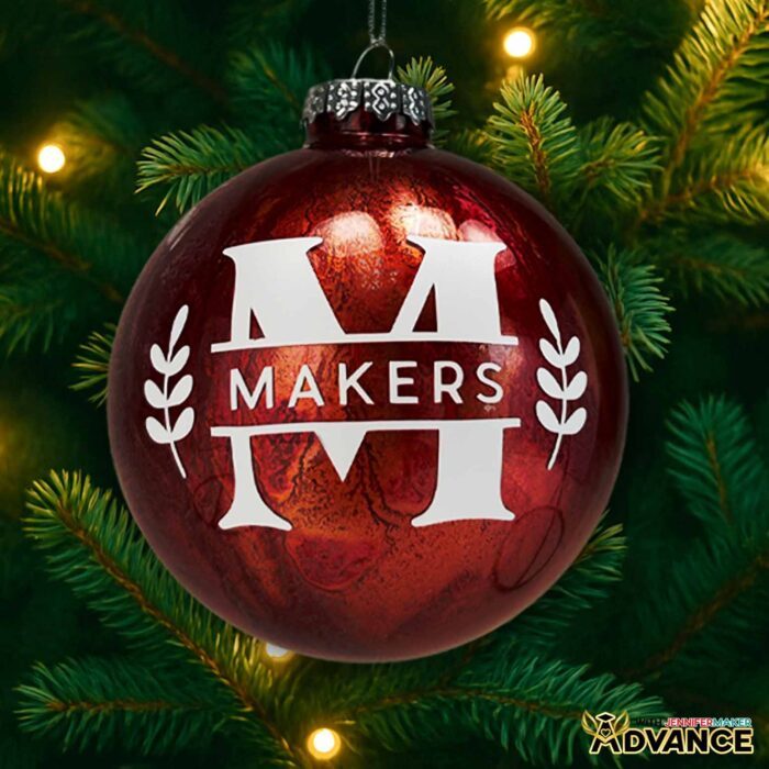 A custom red alcohol ornament with a split "M" monogram and the name "Makers" in white vinyl.