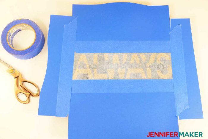 Cover your stepping stone with tape and paper to protect it from paint