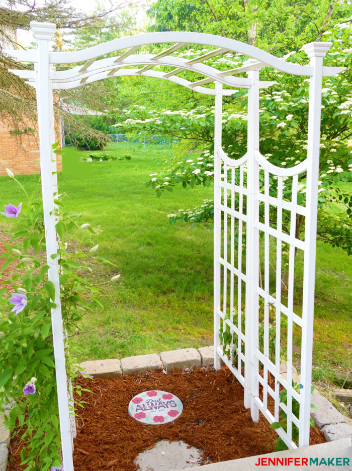 An arbor with painted concrete stepping stones makes a beautiful memorial