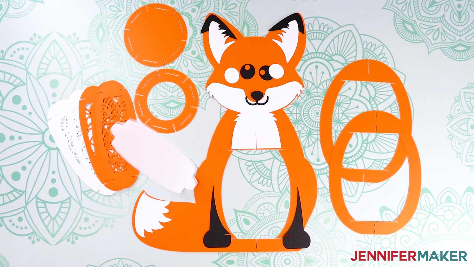 The cut cardstock and vellum pieces for the fox paper lantern.