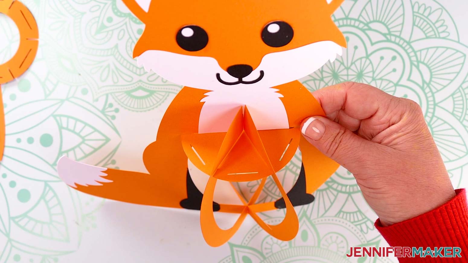 Insert the fox lantern's solid top base piece&rsquo;s six outer slits into the three frame pieces&rsquo; top slits.