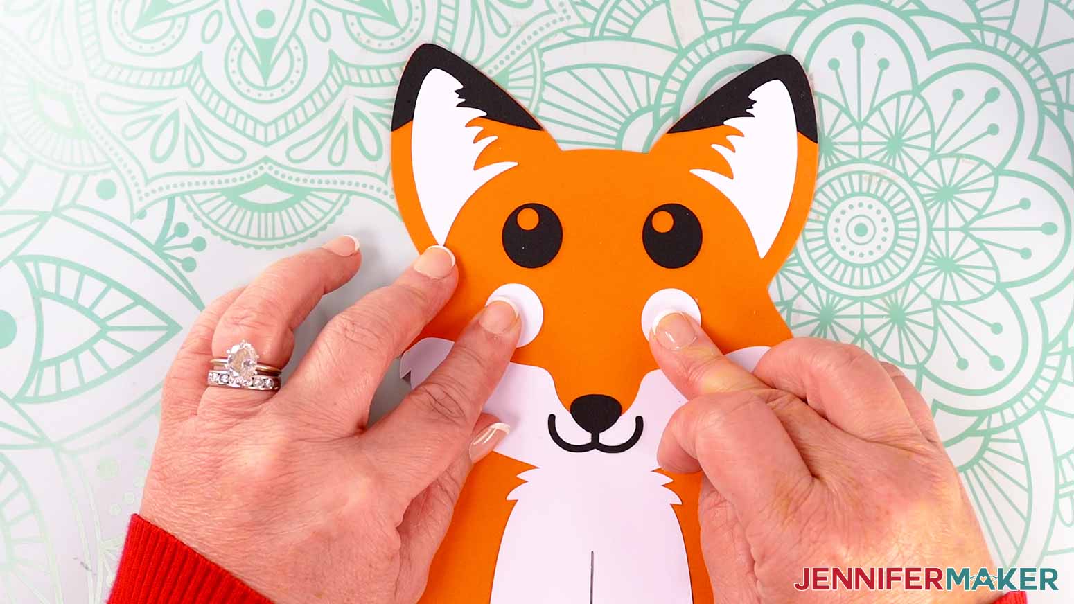 Match up a white and black eye piece with the circular cutout of the eye facing the direction you want the fox to be looking on your fox paper lantern.