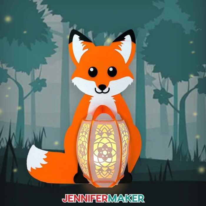 An adorable orange fox Paper Animal Lantern with a smiling face and an intricately cut body glows against an enchanting forest scene.