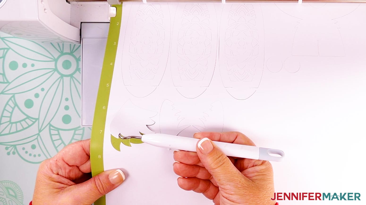 When the Cricut has finished cutting, gently lift a corner of the cardstock with a weeding tool to make sure it is cut all the way before unloading the mat.