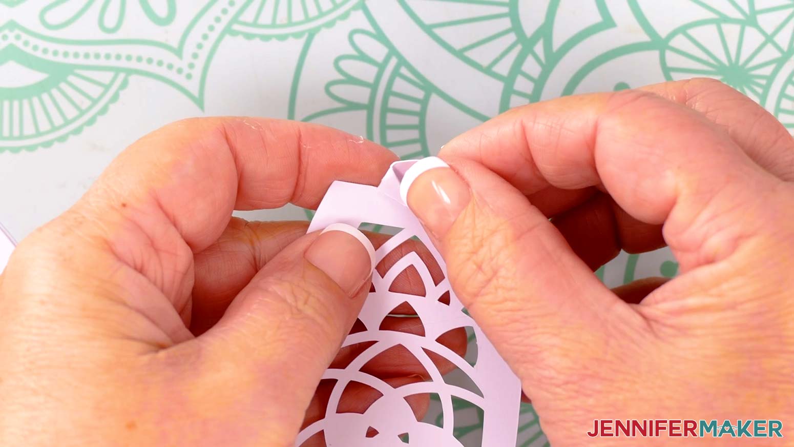 Take the first fox lantern panel piece and fold back the top tab&rsquo;s two wings along the vertical crease lines.