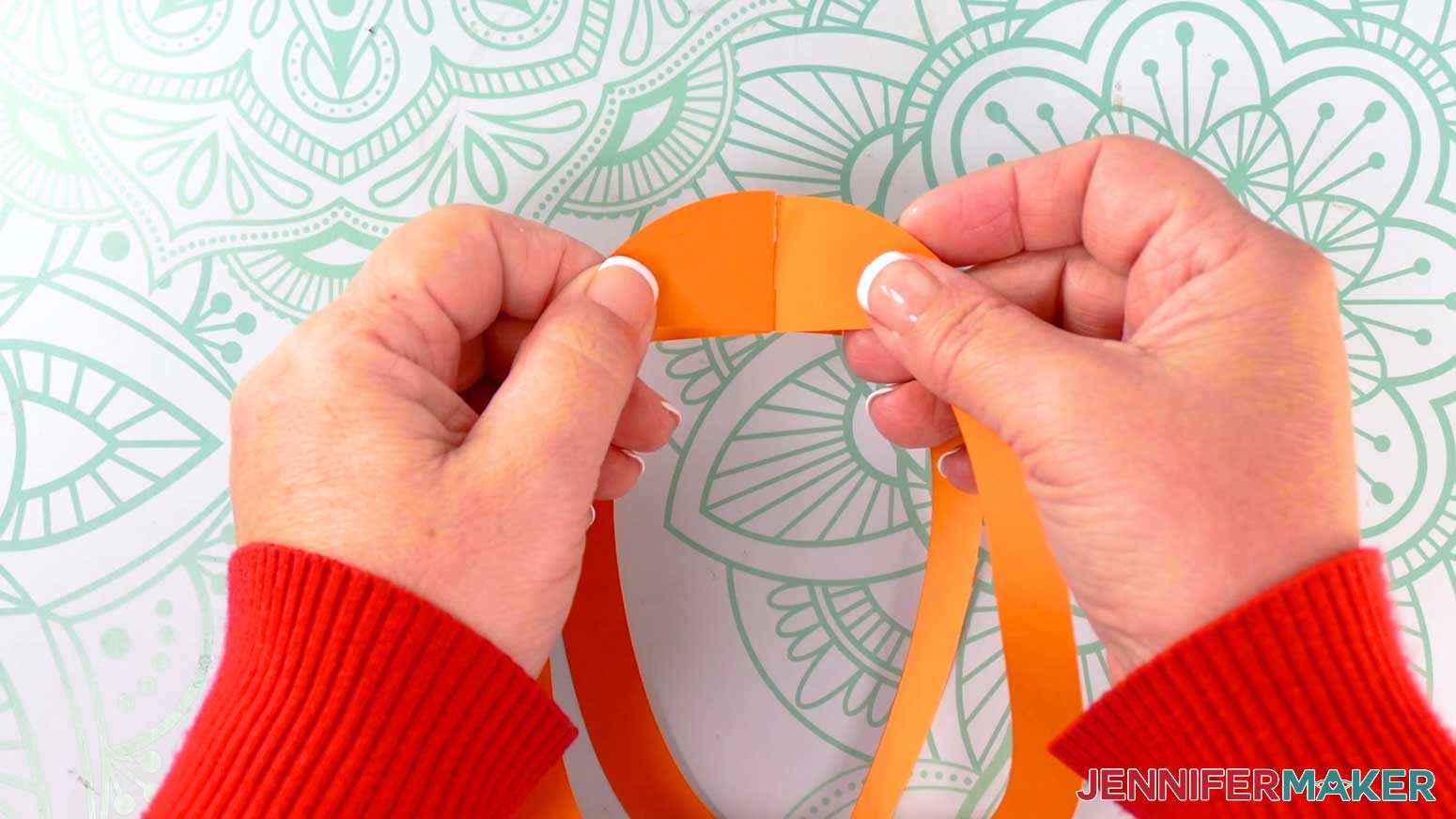 Take the two fox lantern frame pieces and slot them together, one inside the other.