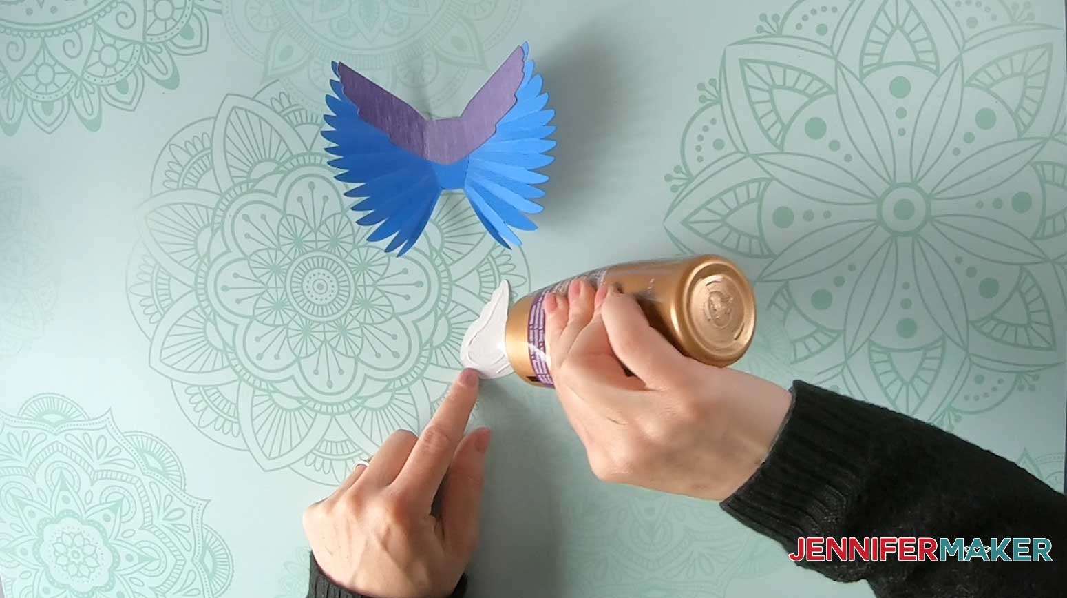 Apply glue to the paper bird top decorative accent piece