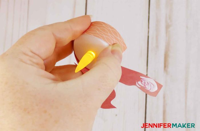 Wrap the paper around the LED tealight to make the bird nest.