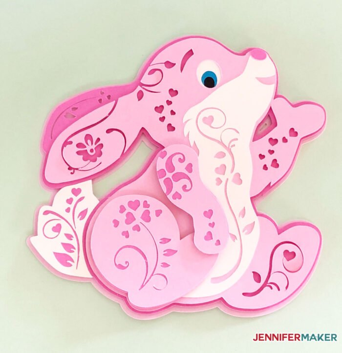 Pink paper bunny in a 3D filigree style