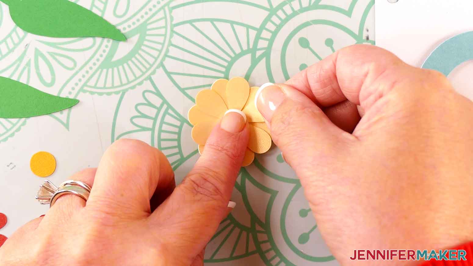 Press the flower off set with the second yellow flower piece to show the petals from the layers between each other.