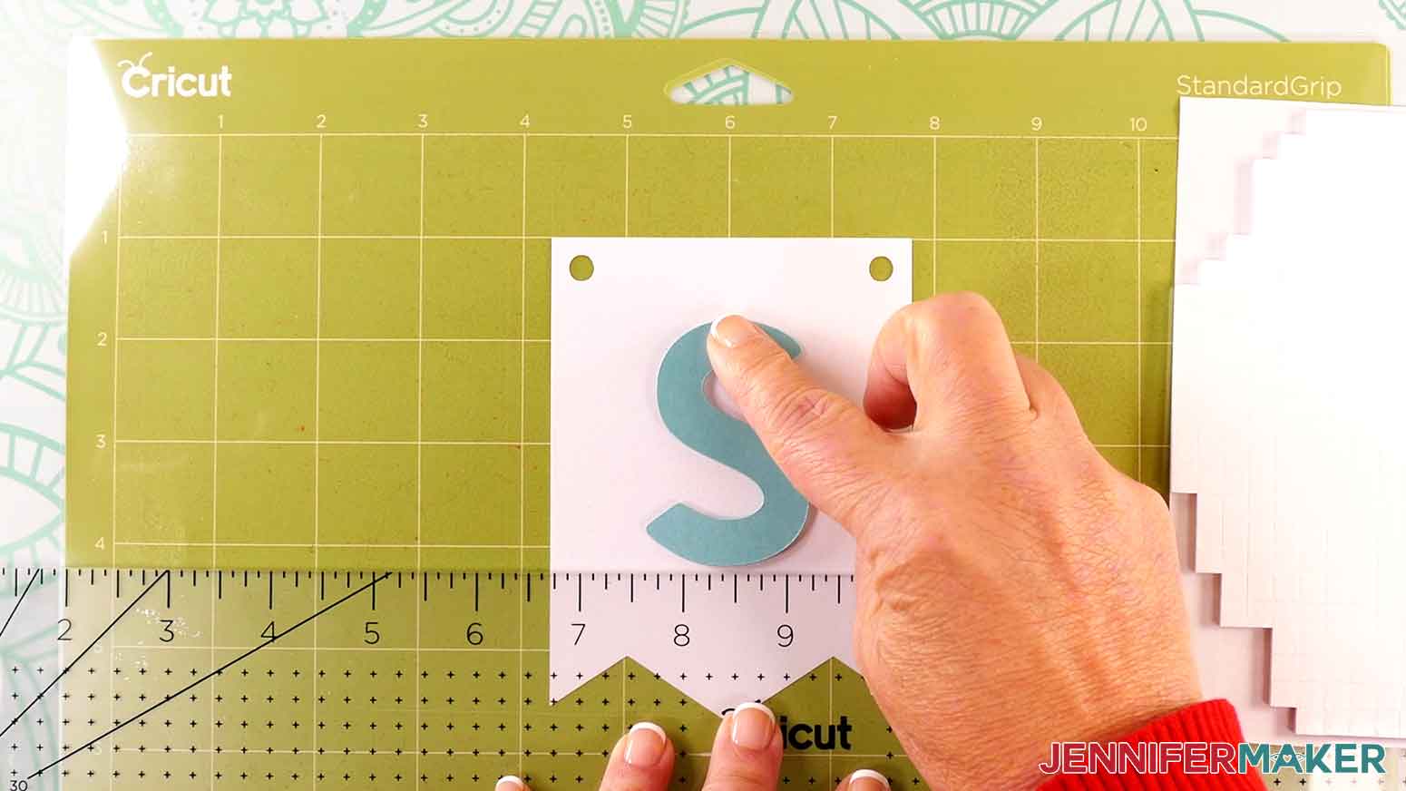 Align and press the S to the banner panel and continue for the remaining letters.