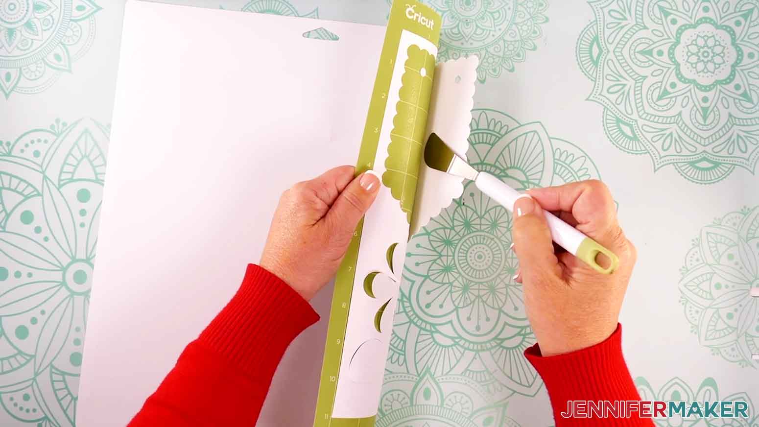 Gently roll the machine mat away from the cardstock to prevent curling while removing the pieces from the mat.