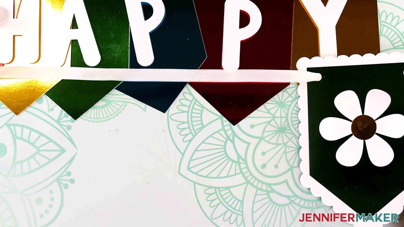Allow about 12 inches at the end of the ribbon for hanging the banner.
