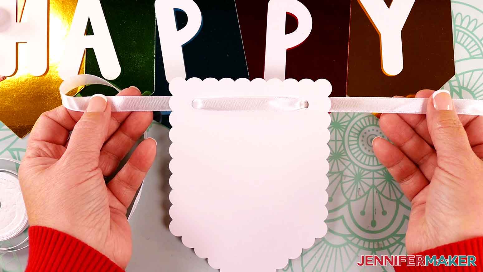 Pull the ribbon up through the left side of the banner panel and straighten out any twists in the ribbon.