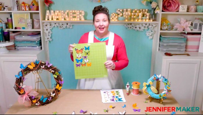 Jennifer showing how to make paper butterfly wreaths using the Print Then Cut feature on the Cricut