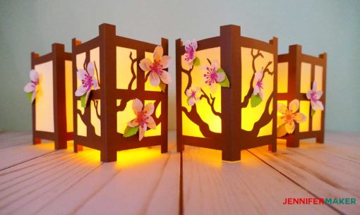 Paper cherry blossom flowers on Japanese paper lanterns