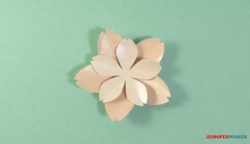 Glue the smaller petals on top of the larger petals to make your paper cherry blossom flower