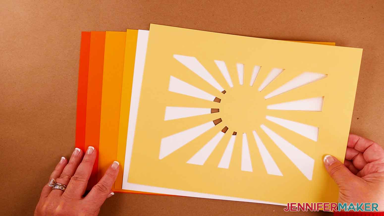 The six cut cardstock layer pieces for the paper cut light box tutorial