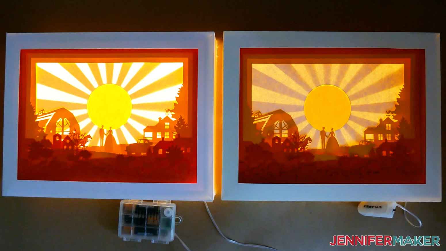 Two finished paper cut light boxes with DIY cardstock frames and colored layers side by side. The one on the left has LED strip lights shining through the layers and the one on the right has fairy lights shining through.