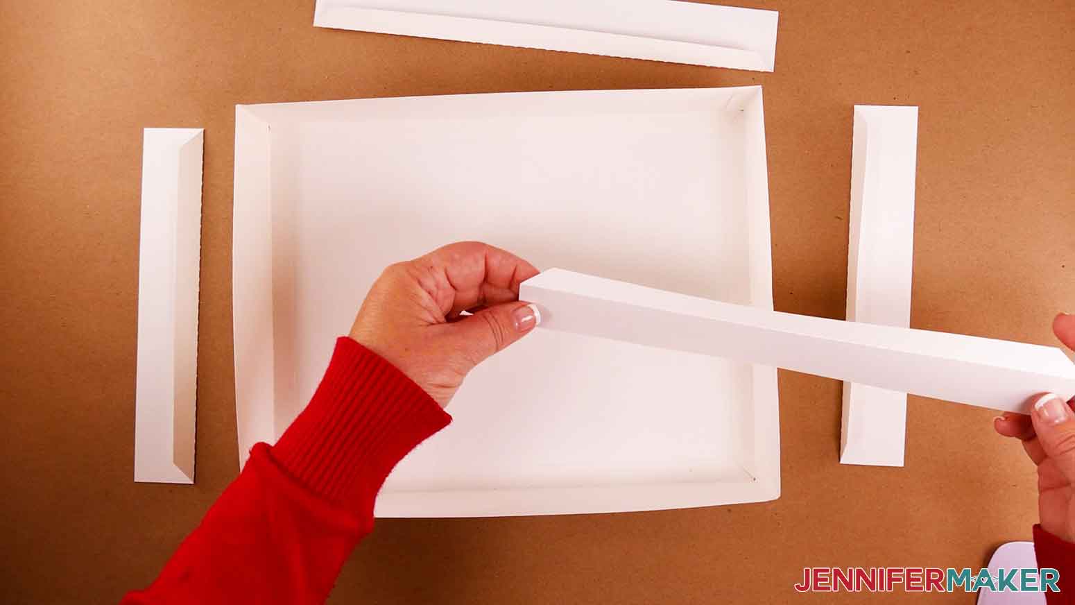 Showing a folded shelf piece for the paper cut light box DIY cardstock frame