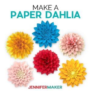 Multicolored paper dahlias on a white background.