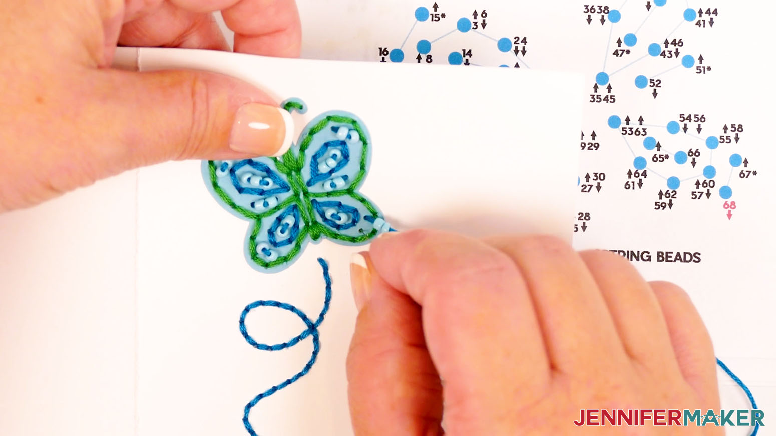 Continue through the steps of the inner butterfly wing design and insert the needle down through hole 68 to finish the wing design.