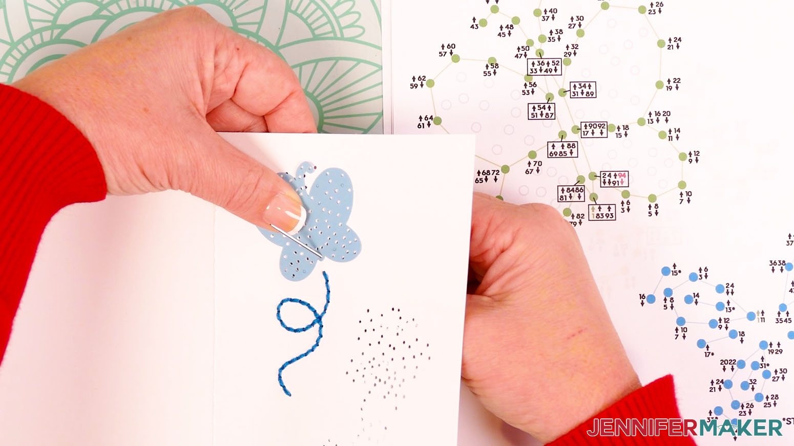 Place the butterfly accent piece over the card and bring the needle up through hole one of the butterfly outline.