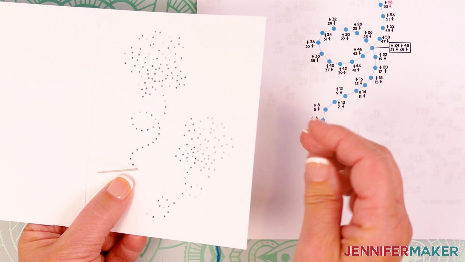 Insert the embroidery needle up through hole one, entering from the back of the card.