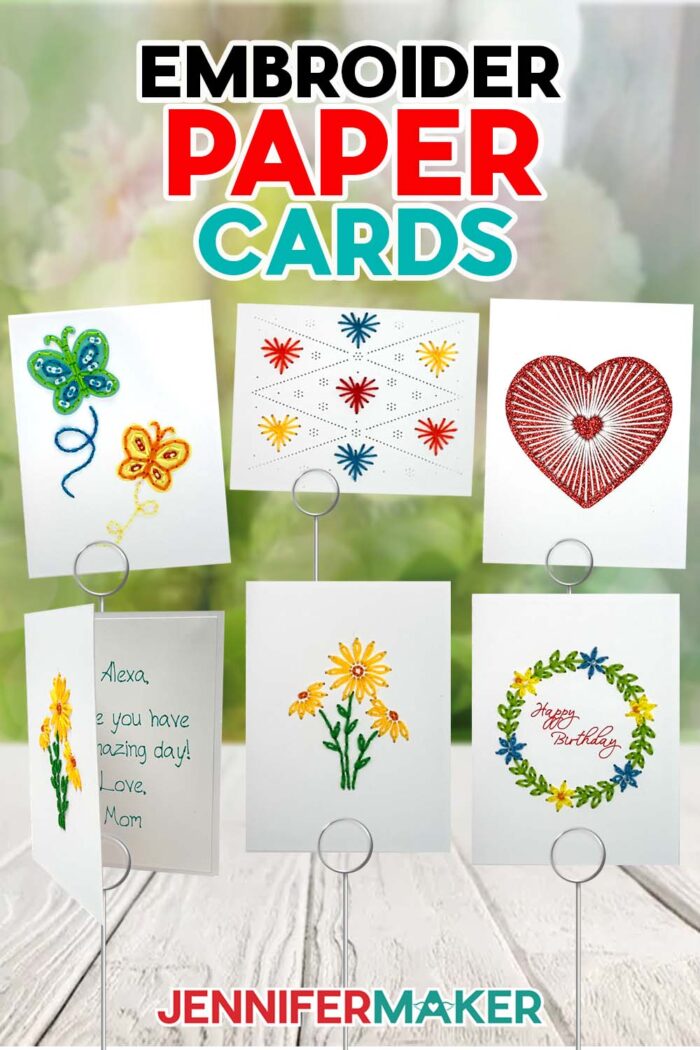 Get free SVG files to make Paper Embroidery Cards! A collection of hand-embroidered cards sits on display on an outdoor wooden table, with designs ranging from hearts to flowers to butterflies