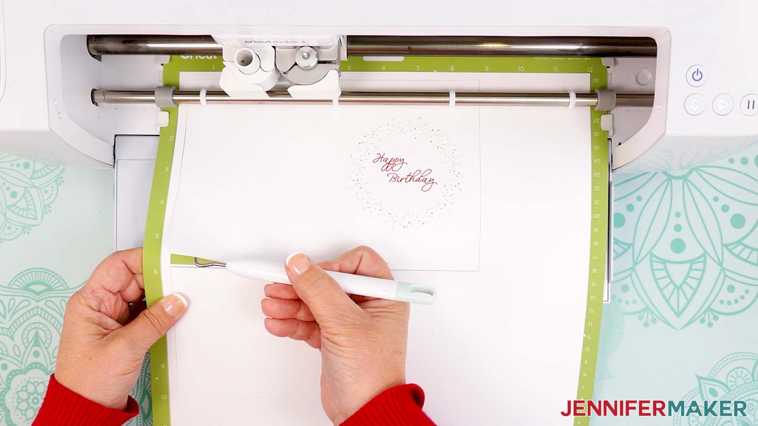 Gently lift the corner of the design to make sure the cut cleanly goes all the way through the material.