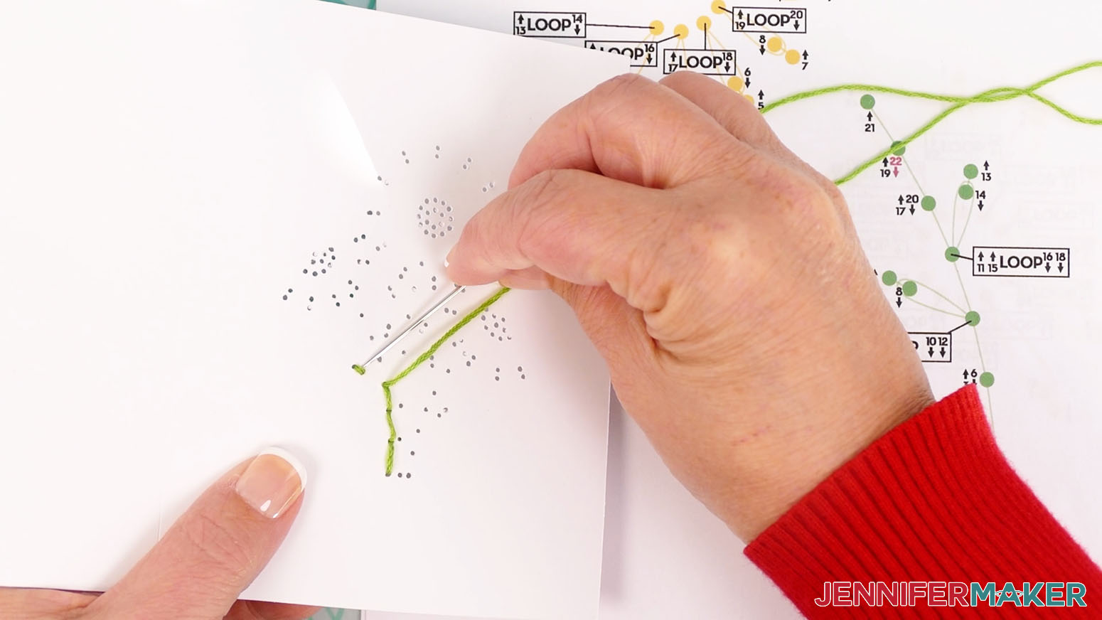 Insert the needly under the threaded line to create a looped petal shape.